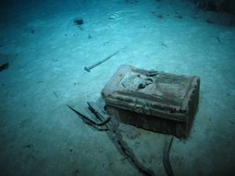 Wooden crate on seabed